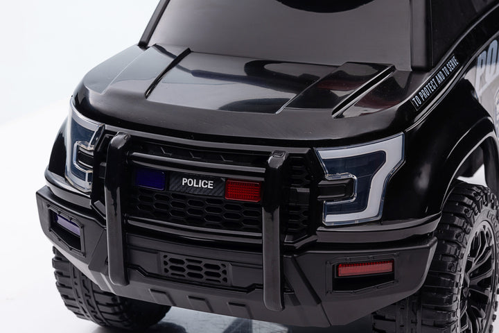 Toddler police push car in black