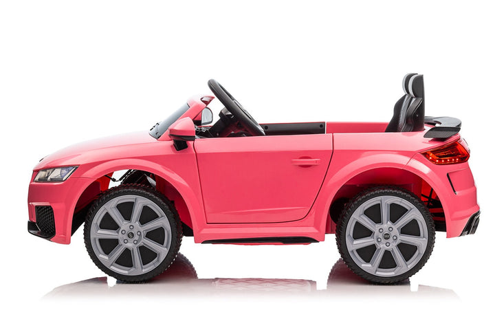 Kids ride one electric car in Pink