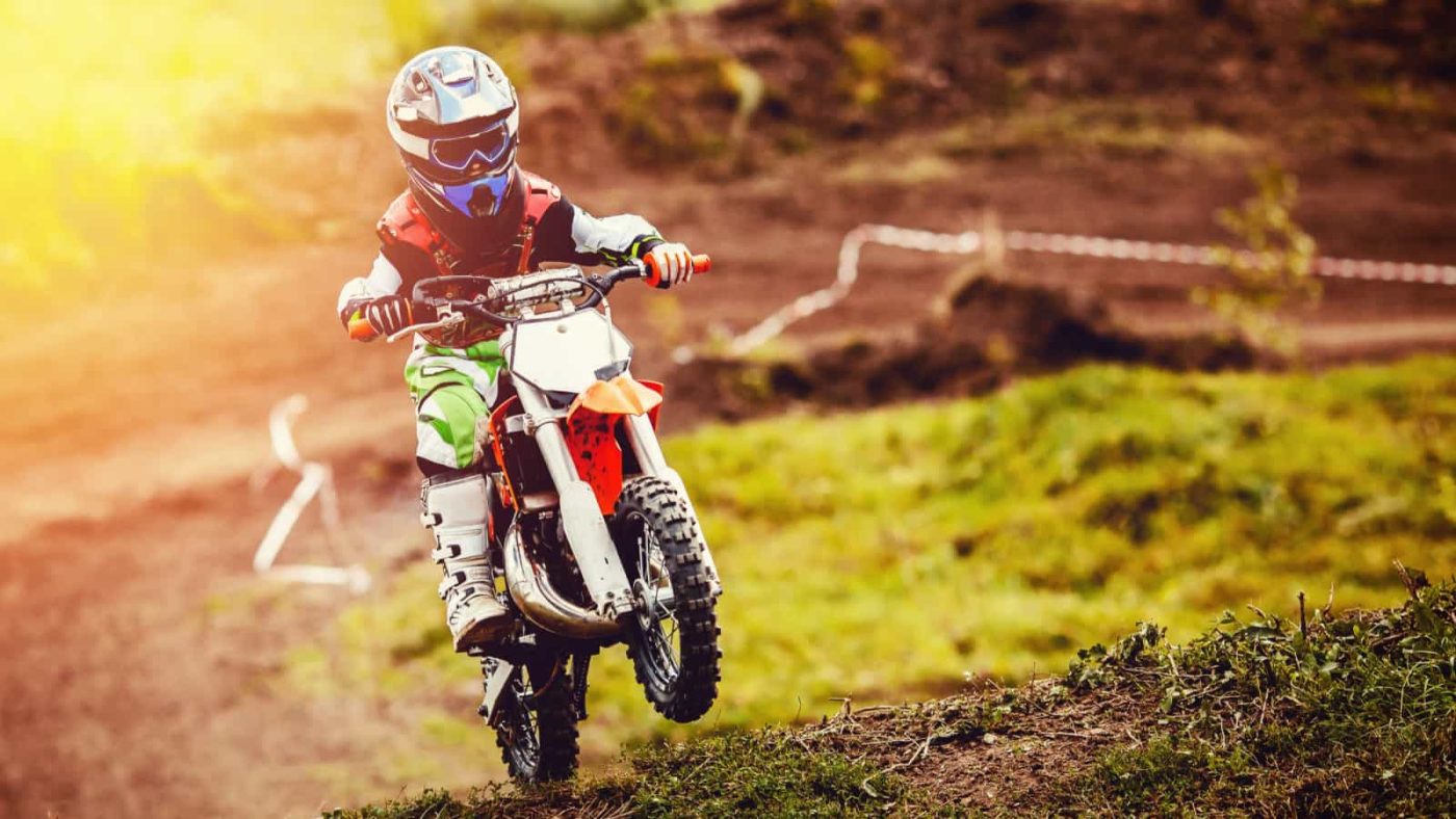 child on electric dirt bike