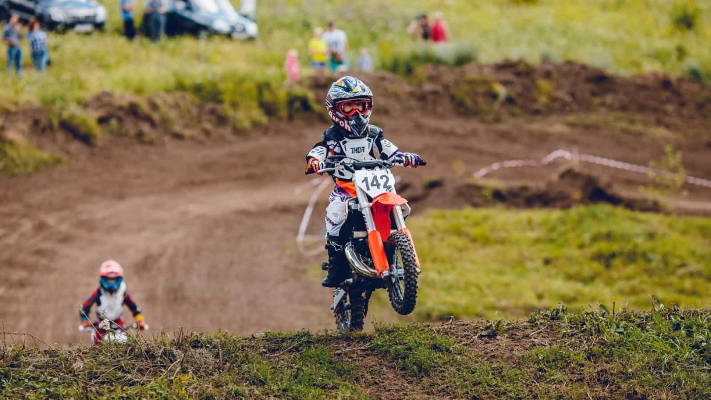 Children on electric dirt bike